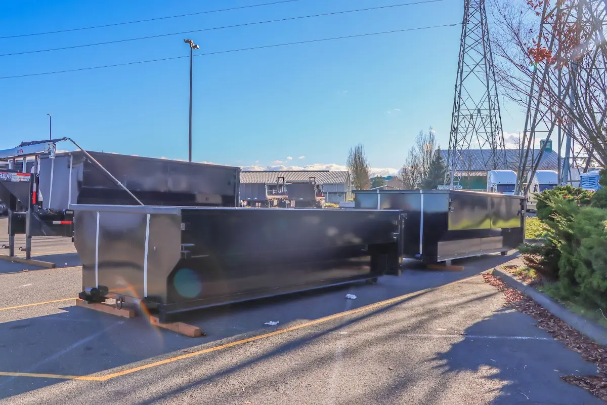Roll-off dumpster ready for waste disposal at job site for Demolition Dumpster Rental in Wilson